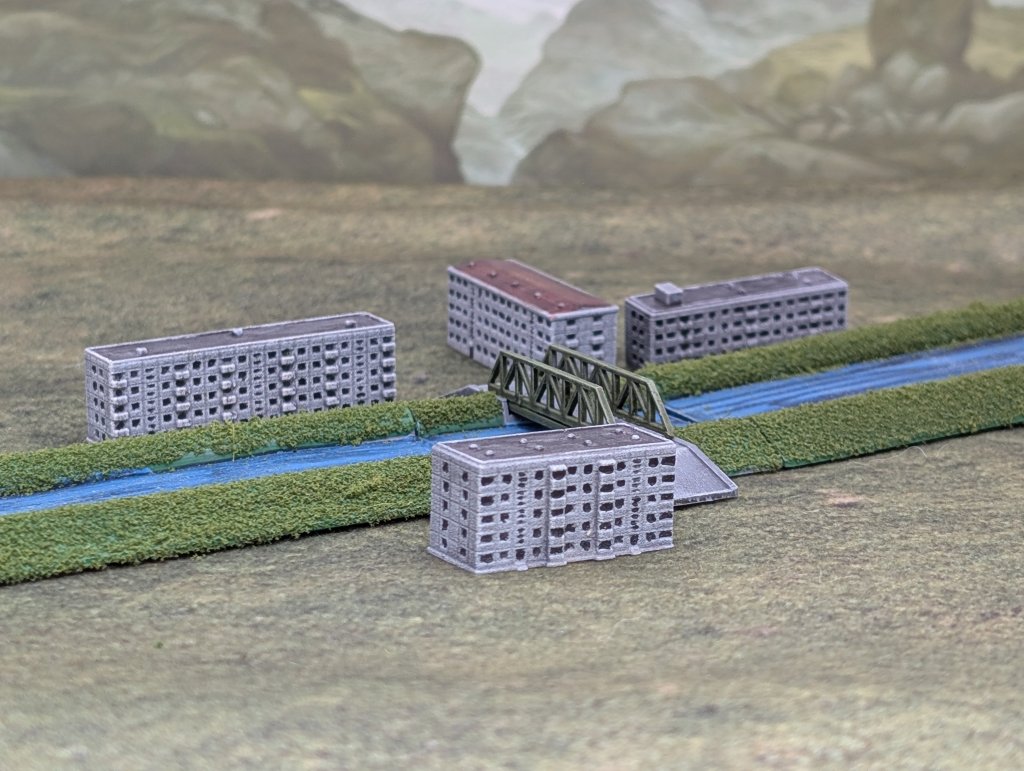 Image of a 1/1000th scale model canal bridge with apartment blocks either side